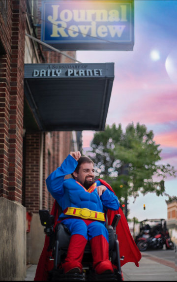 Stephen Hamilton poses as Superman outside the Journal Review offices. The logo for the Daily Planet, Clark Kent’s day job, was superimposed into the photo.