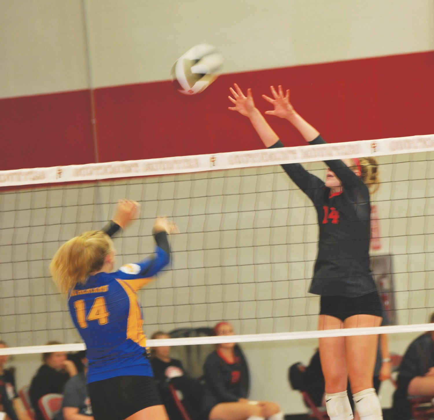 Southmont's Sidney Veatch reaches for the block of Crawfordsville's Macy Bruton in a match this season.
