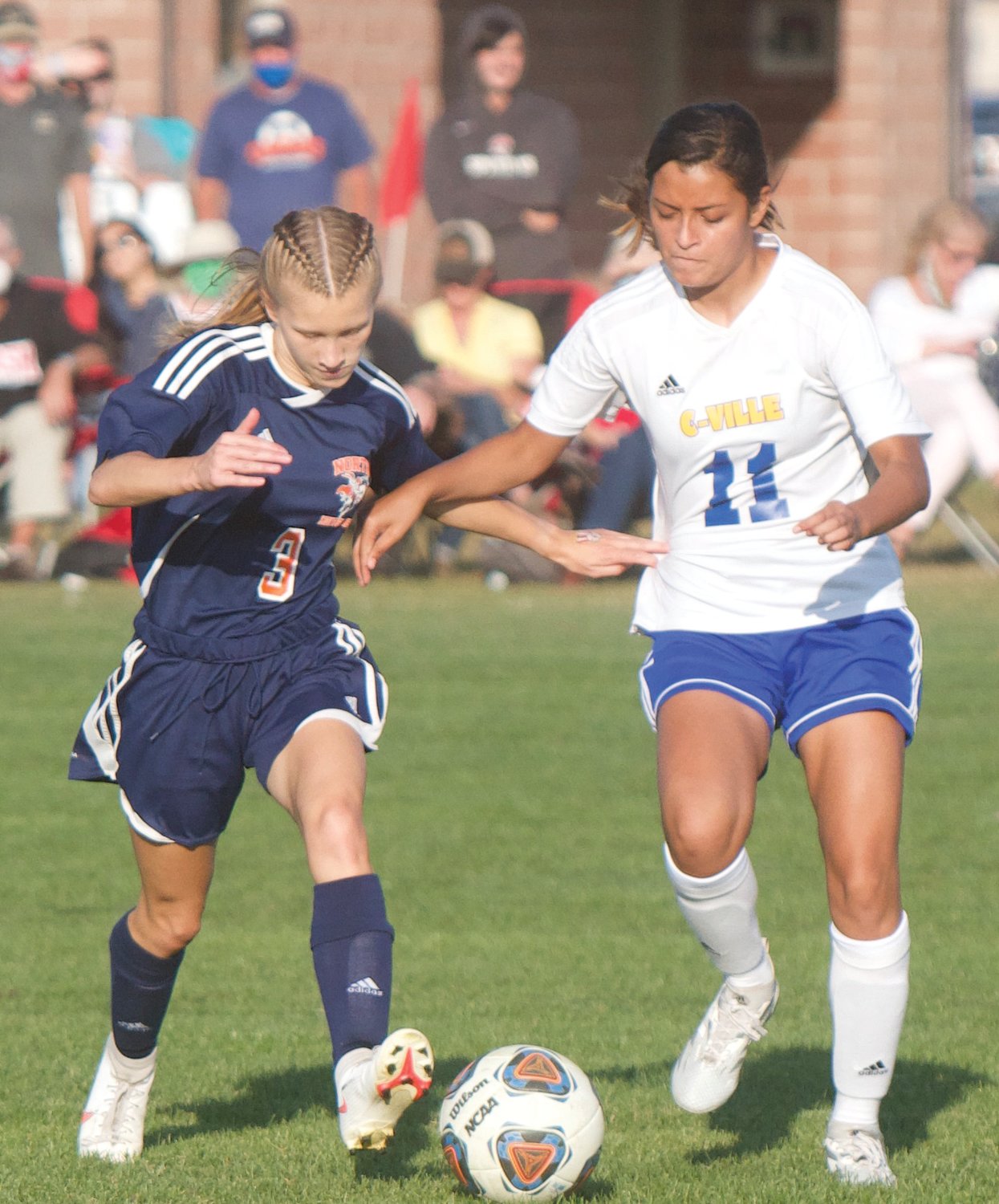 North Montgomery’s Caitlin Burns and Crawfordsville’s Giselle Rojas Jacome fight for position.