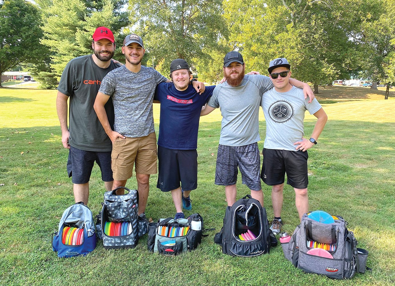 A group of frisbee golfers from Bartlett, Illinois visits the links at Milligan Park on Friday, taking a break from their campsite at Raccoon Lake this week. The Illini visiting Friday include Kevin Ostrander, from left, John Gerdevich, Evan Kownacki, Anthony Yurik and Austin Kownacki.