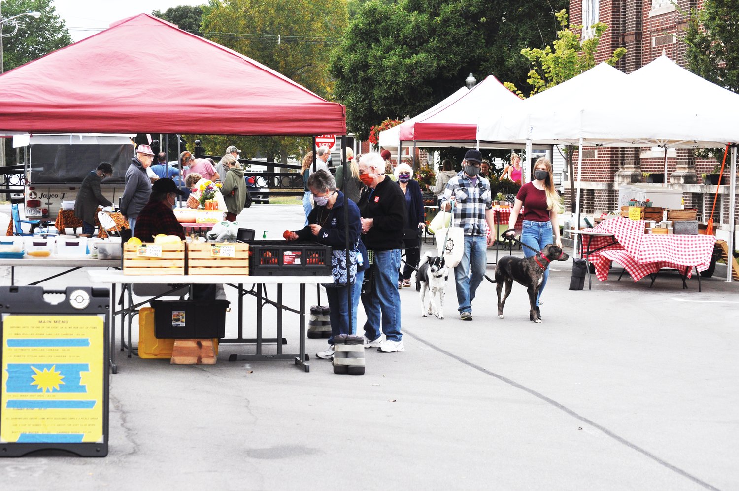 Shoppers browse the Crawfordsville Farmers' Market Saturday at Pike Place. The season is scheduled to continue through October.
