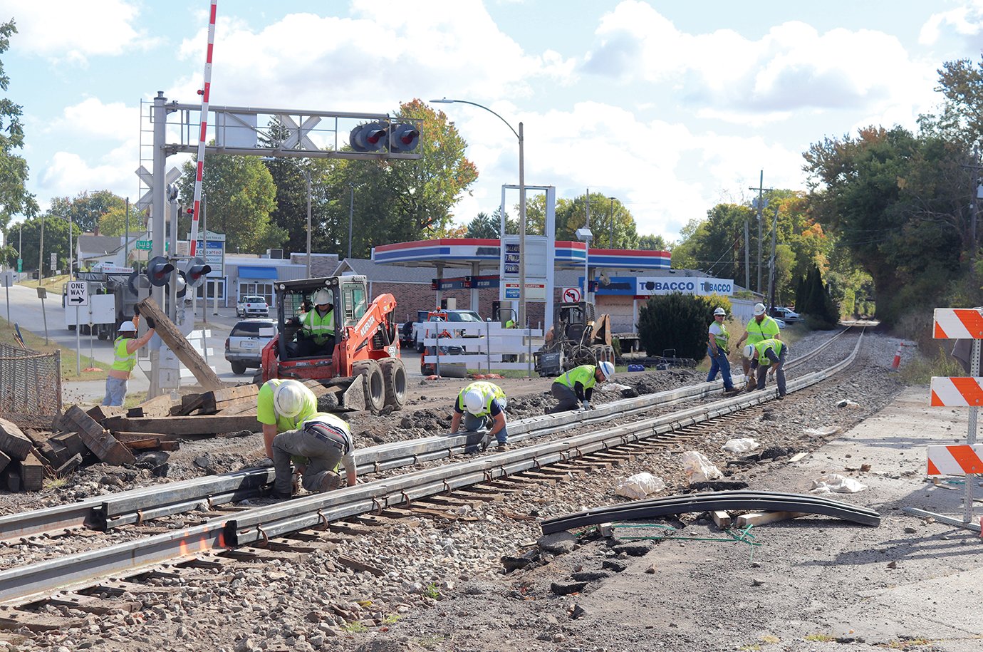 Crews from CSX Transportation and Price Excavating perform track-replacement work on the Market Street railroad crossing Friday ahead of Saturday's scheduled reopening.