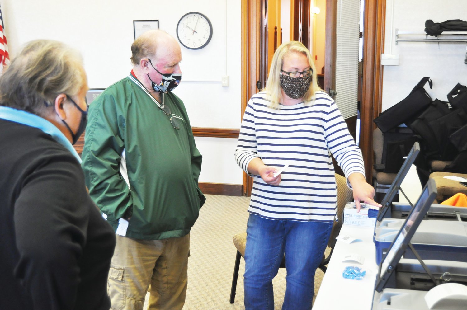 Montgomery County Clerk Karyn Douglas, right, shows a new voting machine to Election Board members Virginia Servies and Daryl Livesay Friday at the Montgomery County Courthouse. The board members observed the required public test of the county's electronic voting equipment.