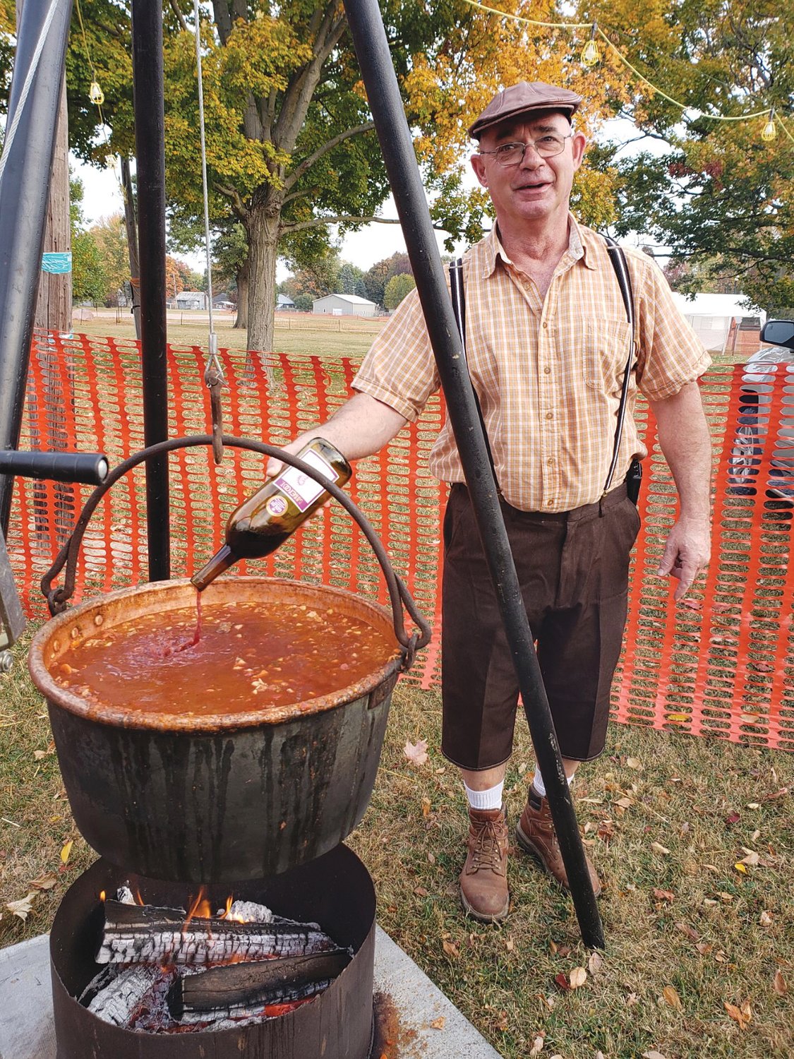 Phil Pirtle cooks goulash over a fire during Oktoberfest 2020 at the Waynetown Park.