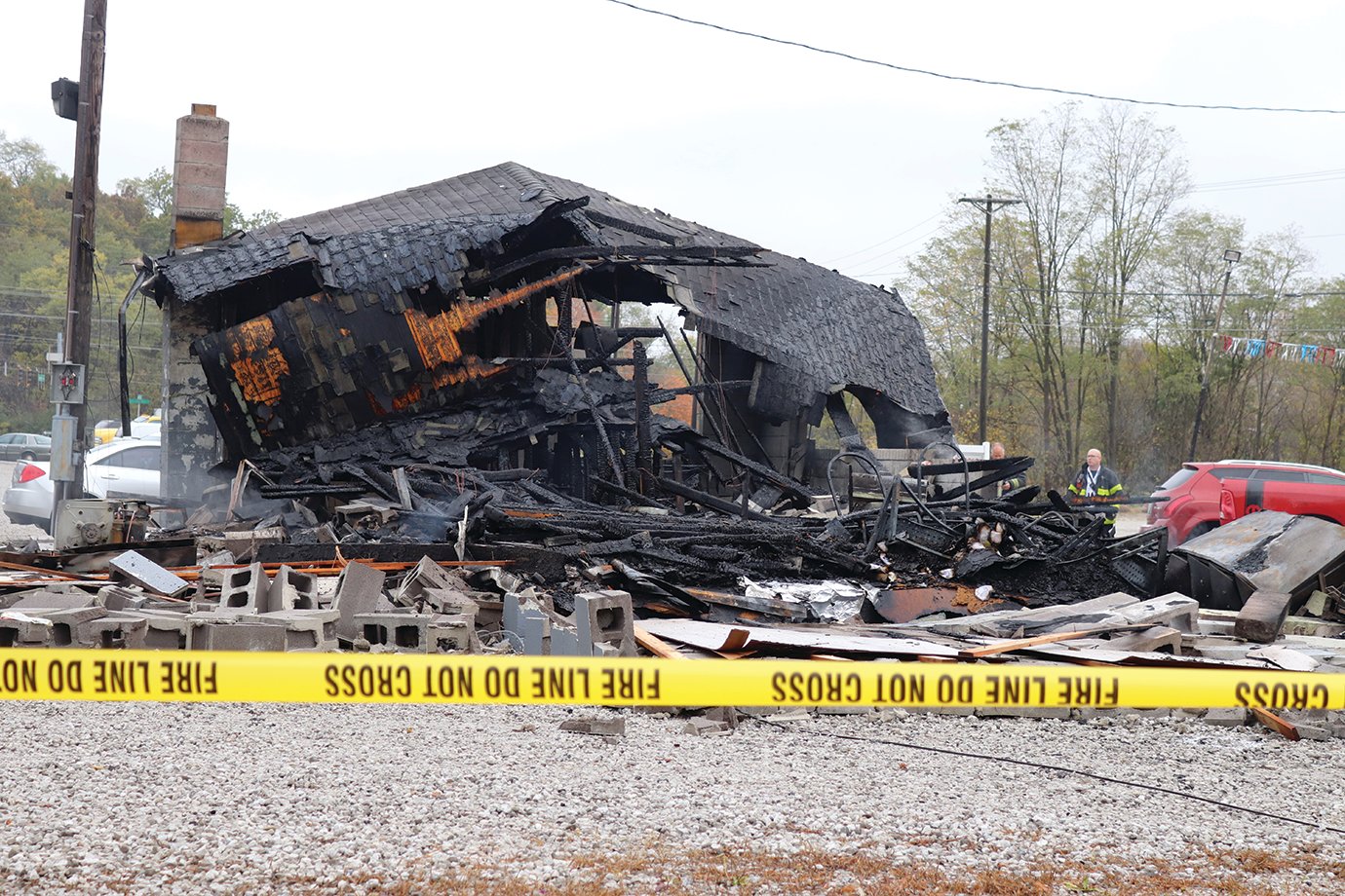 The smoldering ruins of an overnight fire that destroyed Affordable Auto Sales on Lafayette Avenue depict a destructive scene Wednesday morning.