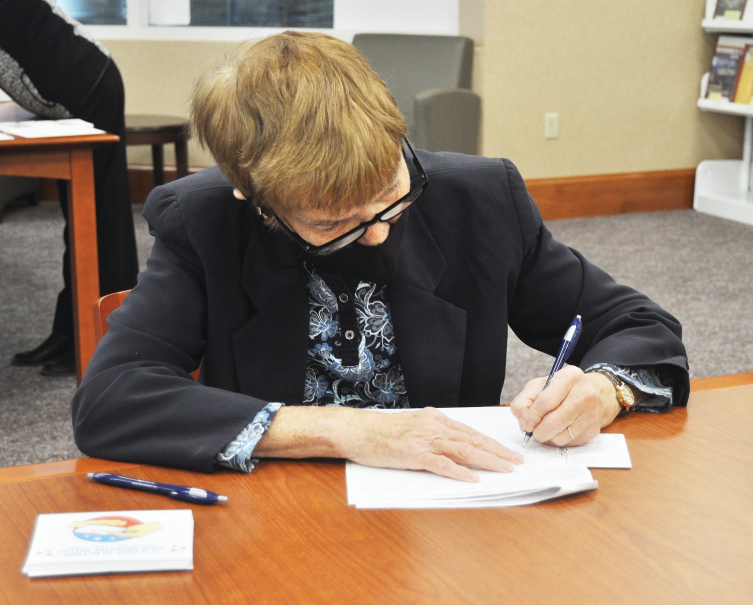 League of Women Voters member Gail Pebworth checks off an address from a list of absentee voters Wednesday at the Crawfordsville District Public Library. The League received permission from the Montgomery County Clerk's Office to send out postcards reminding voters to mail in their absentee ballots. Absentee ballots must be returned to the clerk's office by noon on Election Day Nov. 3. More than 7,000 of the county's 25,406 registered voters have voted early, according to the clerk's office.