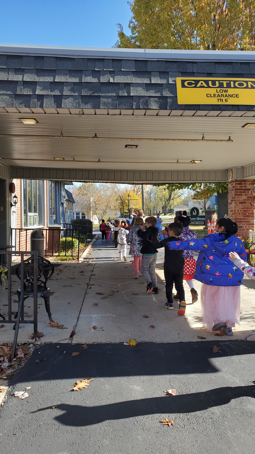 Nicholson Elementary School students paraded in Halloween costumes by Lane House Nursing Home on Friday for residents to see.