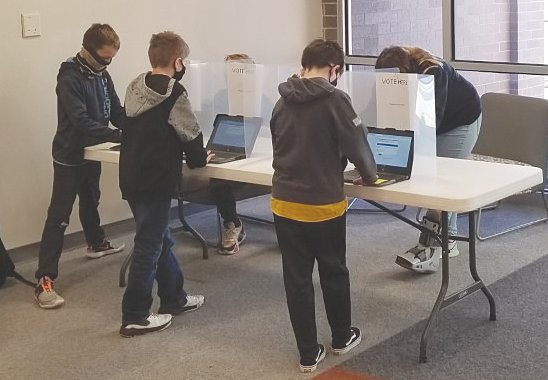 North Montgomery Middle School students vote in a mock election. The social studies department created a simulation of the real voting atmosphere with students voting locations throughout school, students having to show identification to poll workers, and voting booths.