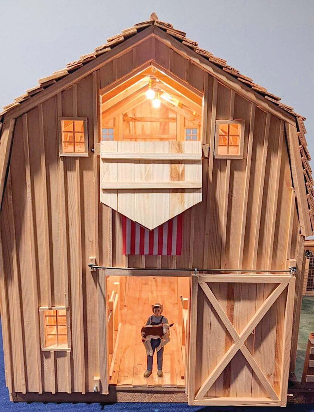 The exterior of a miniature barn built by Richard Peterman depicts scale accuracy.