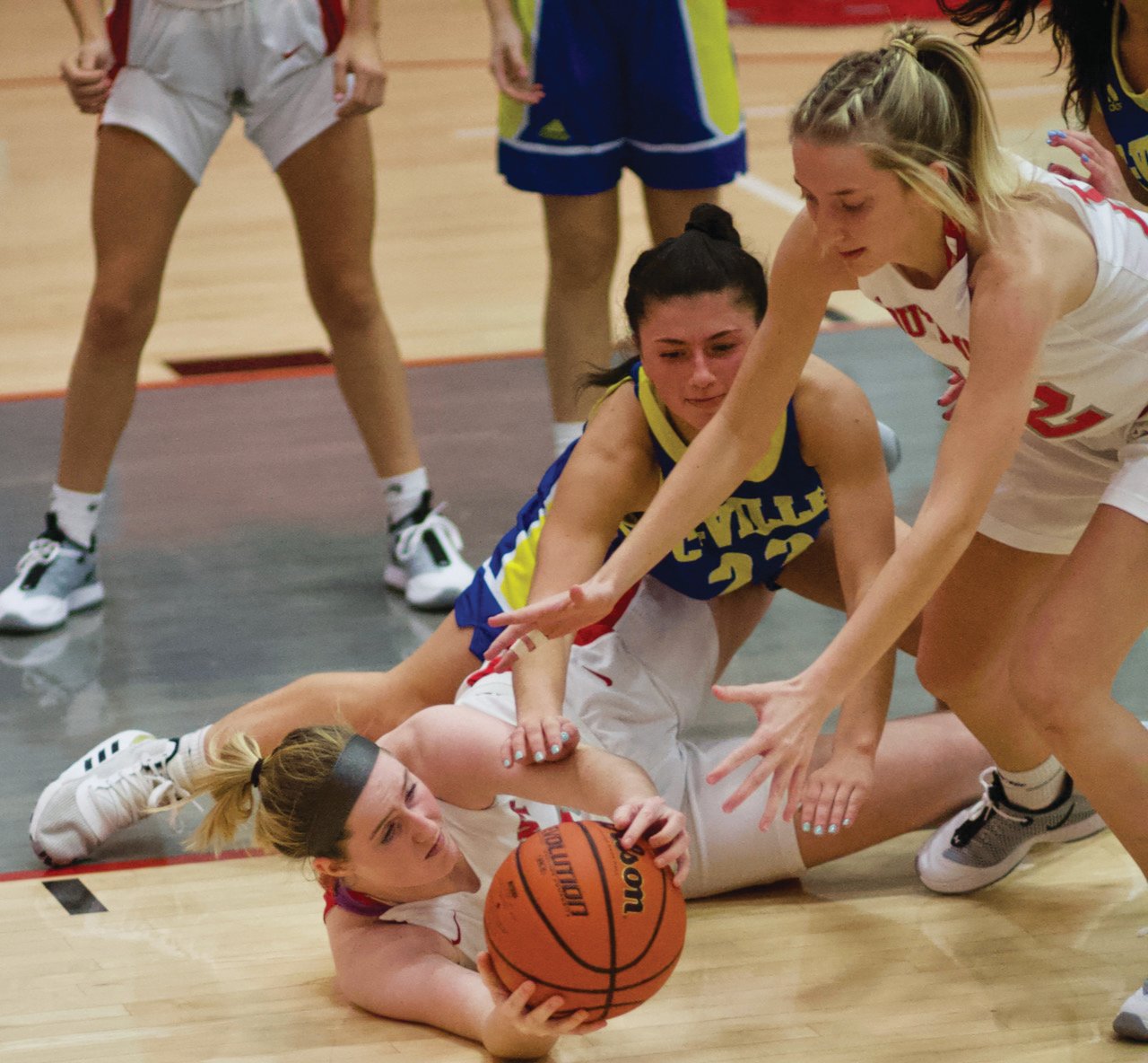 Crawfordsville’s Shea Williamson and Belle Miller fight for a loose ball.