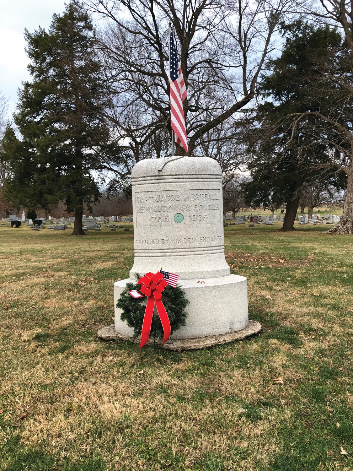 A wreath decorates a monument for Revolutionary War Capt. Jacob Westfall at Oak Hill Cemetery North. Westfall was buried in Putnam County.