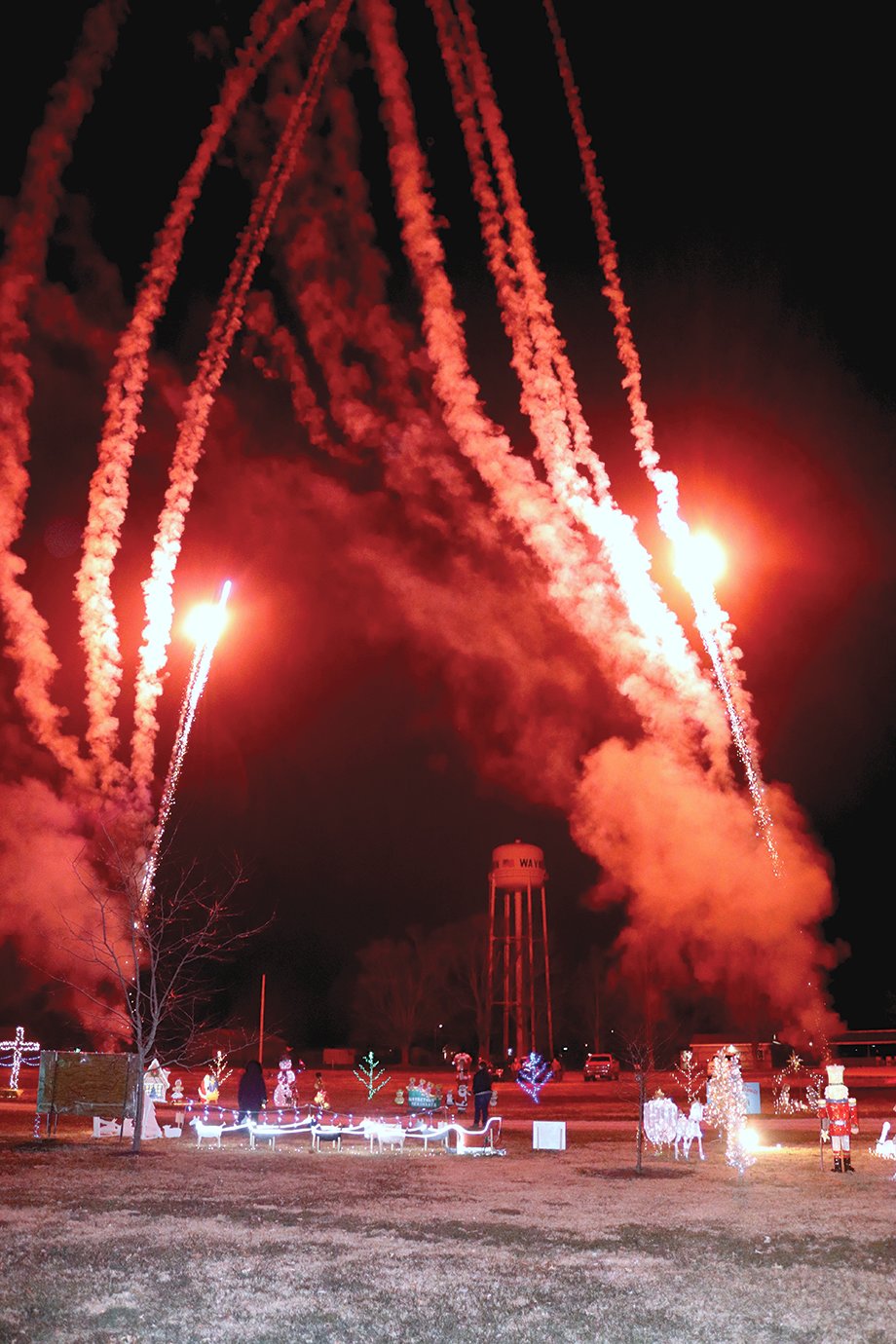 Santa's entrance to Christmas in the Park in Waynetown is marked by red and white fireworks.