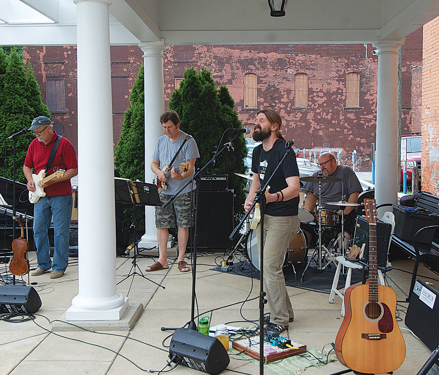 Joel Weir, center, performs with his band John the Silent at Marie Canine Plaza during the First Friday concert series in 2016. A collection of Weir’s music has been released by an independent British record label.