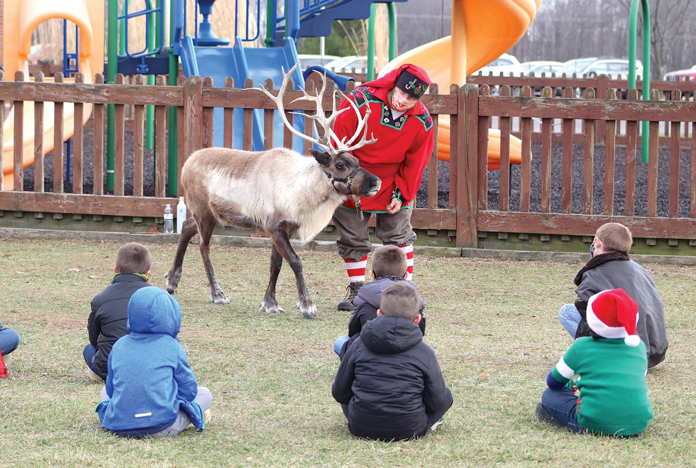 Chris Hanson with Silly Safaris, also known as Candy Cane Chris, shows off 9-year-old female reindeer Clarice on Friday at Sommer Elementary ahead of the upcoming holiday for Jill Callis' second-grade class.
