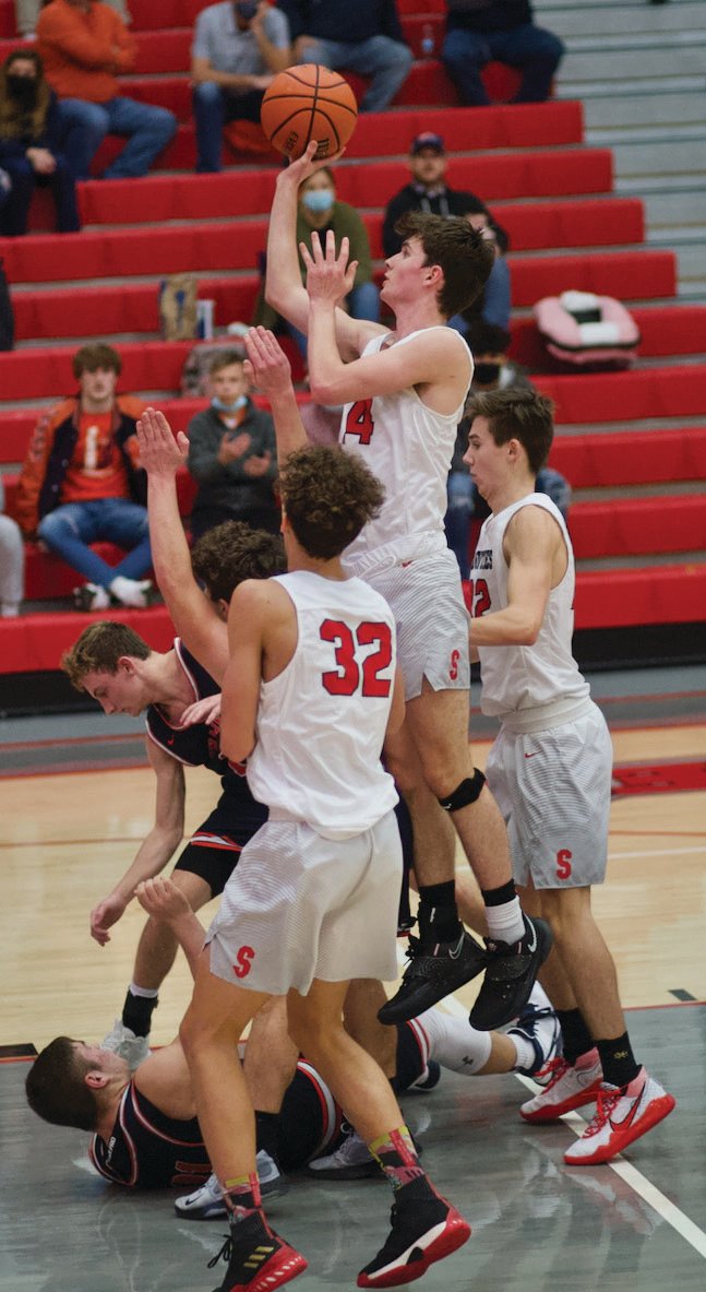 Austin Bowman rises up for a shot in the lane in a game earlier this season against North Montgomery.