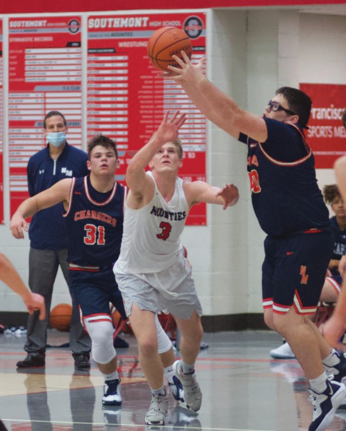 Southmont’s Carson Chadd goes for the steal from North Montgomery’s Jamyson Roche in a game earlier this season. Chadd led the Mounties with 19 points in a win over Shakamak on Saturday.