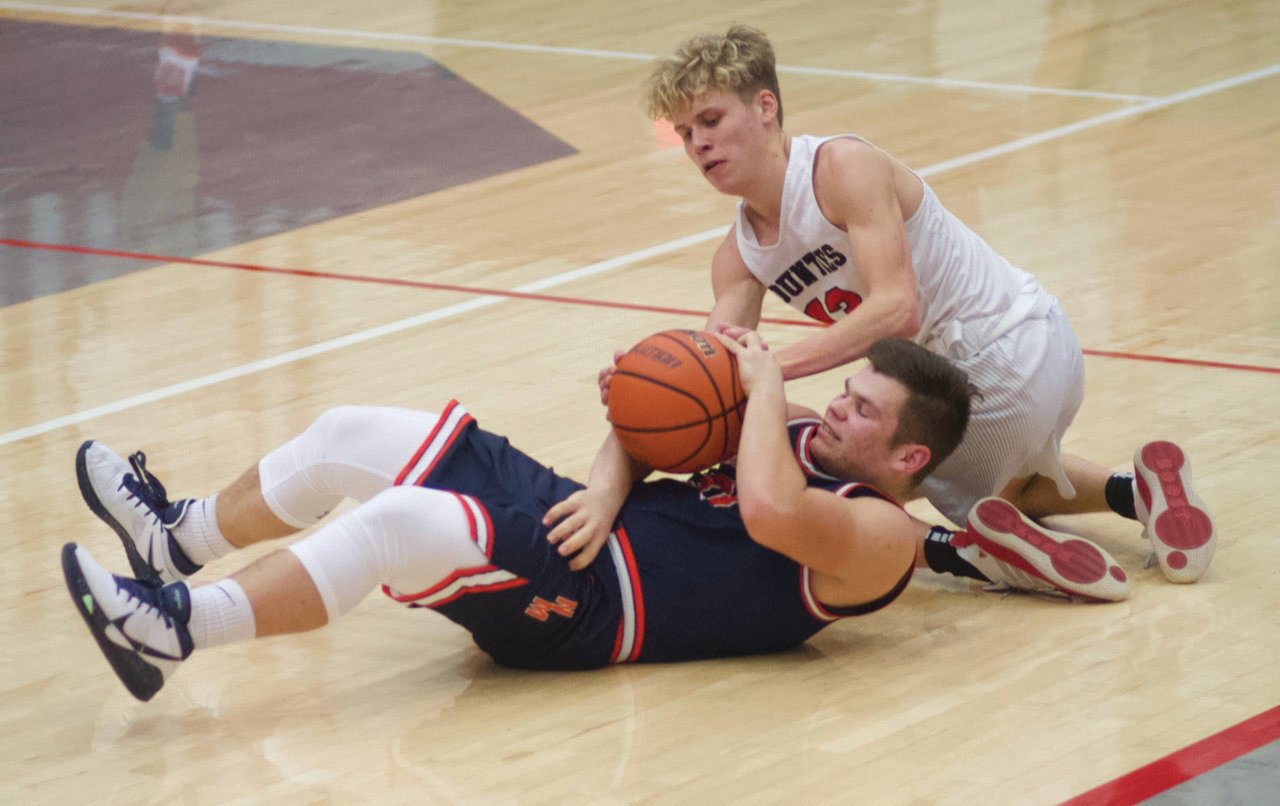 Southmont’s Cale Hess battles for a loose ball in a game earlier this season against North Montgomery.