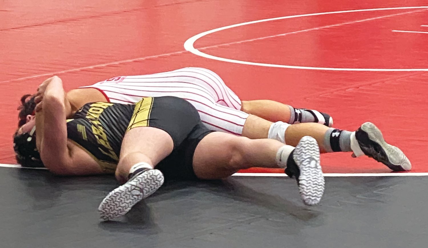 Southmont’s Riley Woodall picks up a fall over Lebanon. The senior went 3-0 on Saturday.