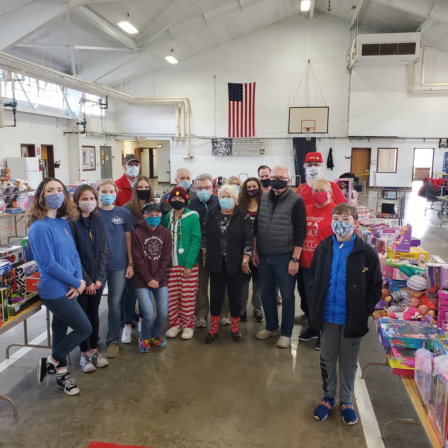 Members of the Crawfordsville Kiwanis and the Crawfordsville Middle School A-Team paired together to help with the annual Operation: 
Toybox campaign. Twenty volunteers arrived at the National Guard Armory to sort and shop, ensuring that kids in Montgomery County will have presents under the tree this Christmas.