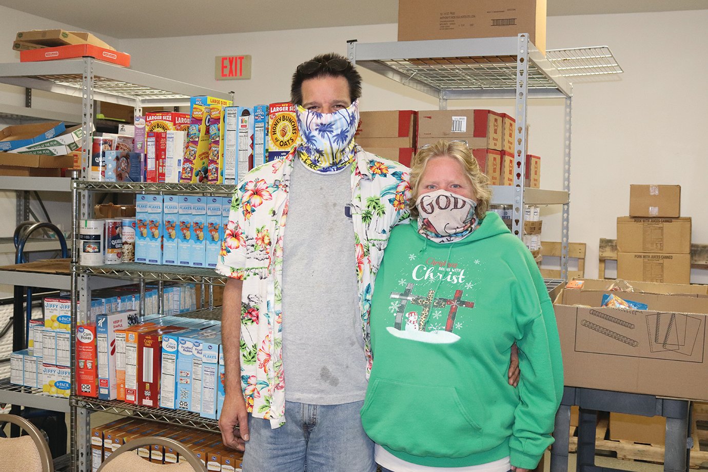Shining Star award recipient Ellen Simpson and husband Brad take a break from stocking shelves at F.I.S.H. Food Pantry. Ellen has been named a Shining Stars in the community by the Journal Review.