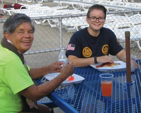 Leah Rusk, right, and her mentor Terry Lawrence enjoy a meal at a JUMP program outing. Rusk has been a program participant since 2012. She is now pursuing a bachelor’s degree at Indiana State University and dreams of a law enforcement career.