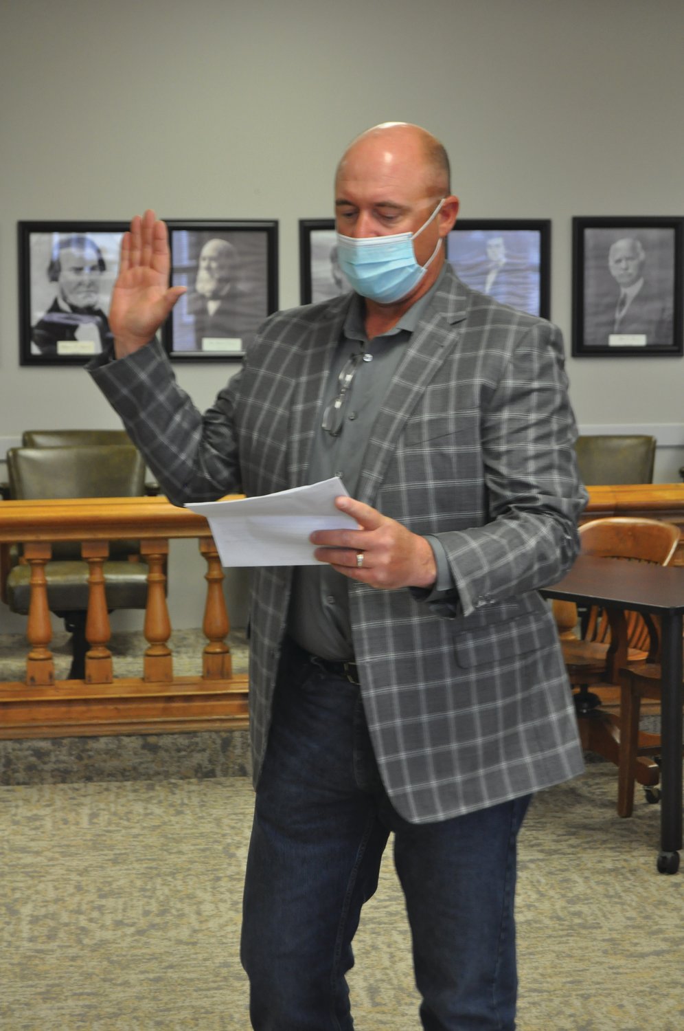 Montgomery County Commissioner Dan Guard takes the oath of office in the circuit courtroom Tuesday.