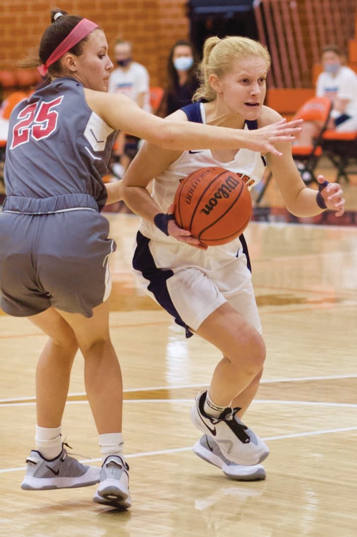 North Montgomery’s Madi Welch drives past Southmont’s Natalie Manion. Welch led the Chargers with eight points in a 55-29 loss to Southmont on Thursday.