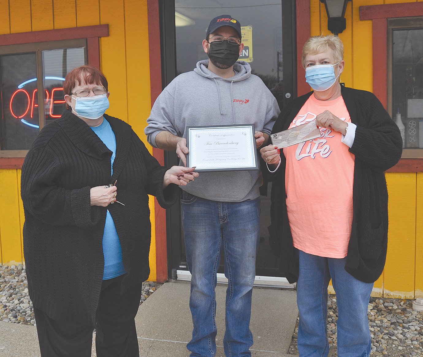 Becky Hankins, left, and Cindy Biddle, right, representing Montgomery County Relay for Life, present Tim Brandenburg of Zippy Lube with a certifcate of appreciation. During the months of November and December, retailer at 707 Englewood Drive, donated $1 from every oil change to the American Cancer Society. Businesses interested in assisting the ACS and the Montgomery County Relay for Life should email cynthiabid@gmail.com. The annual relay is scheduled for July 17.