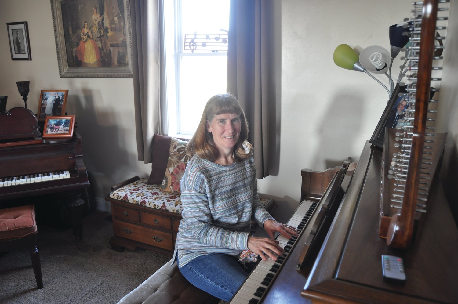 Cindy McCormick sits at the piano in her home. McCormick retired from New Market Elementary in December after a 42-1/2 year career as a music teacher.