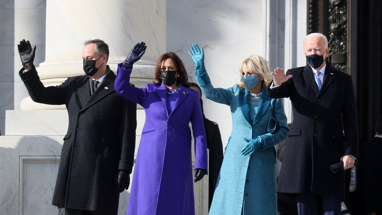 From left, Doug Emhoff, U.S. Vice President Kamala Harris, Dr. Jill Biden and U.S. President Joe Biden wave as they arrive on the East Front of the U.S. Capitol for the inauguration on Wednesday in Washington, DC.