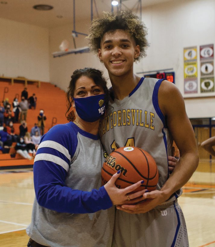 Jesse Hall stops for a photo with his mom, Tish Epperson, following his 1,000th career point for the Athenians.