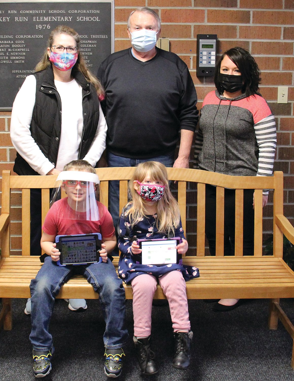 Pictured, from left, in front, are Caleb Myers and Dakota Worden with their speech devices; and back row Robin and Steve Stewart of the Marshall Federated Church and Alyssa Gideon, North Central Parke speech-language pathologist.