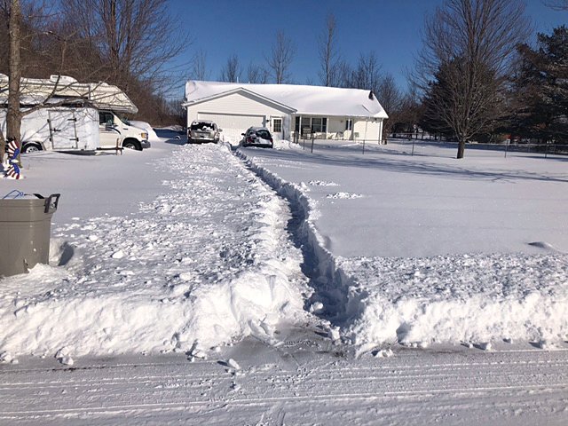 Paula Morton submitted this photo along with the description: “Done shoveling driveway. I do believe the cars can get out now. Lol, Cade Morton.”