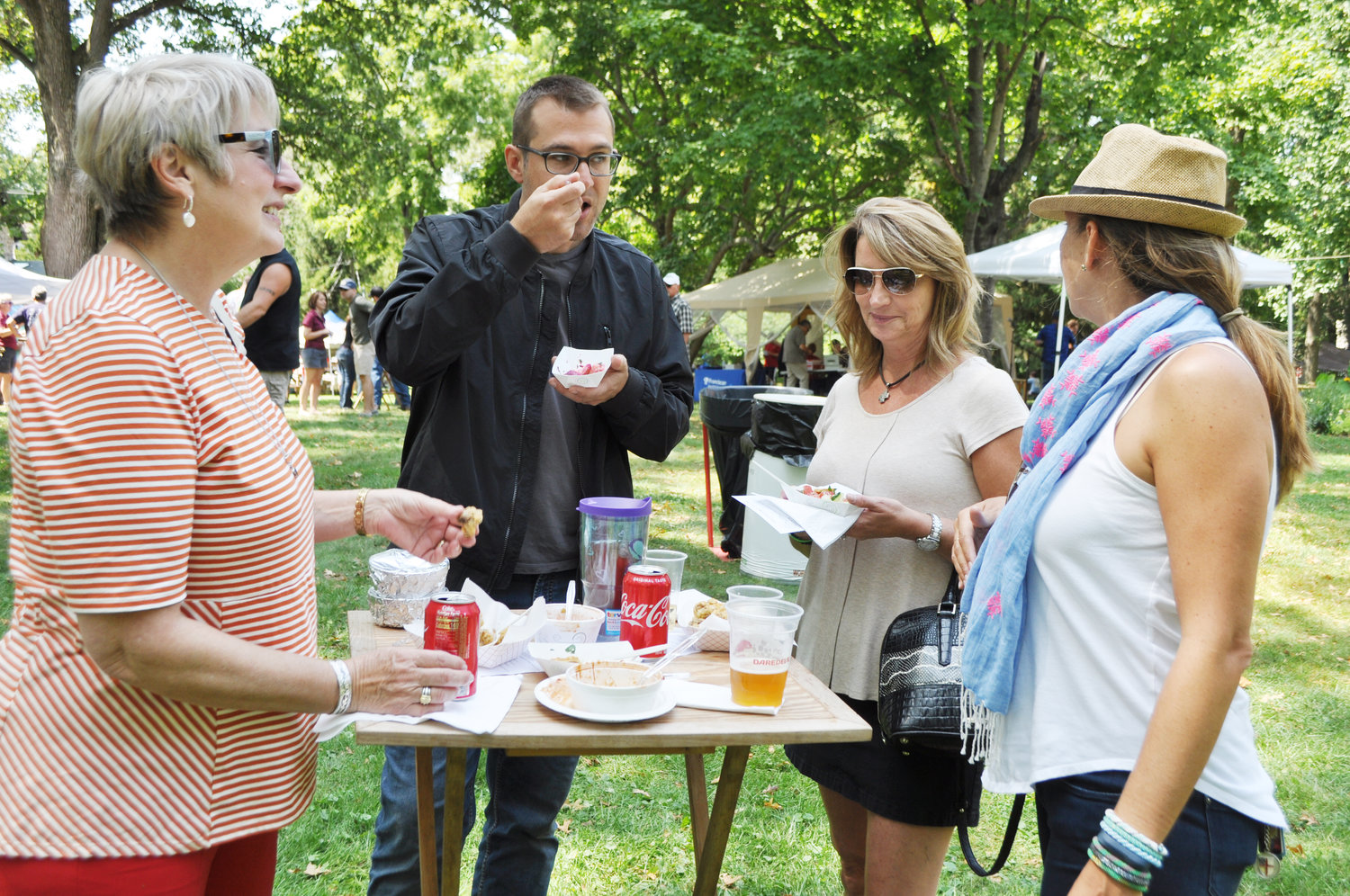 Rees Olander, left, visits with family members Emerson Olander, Sara Olander and Megal Olander at the 2020 Taste of Montgomery County on the grounds of the General Lew Wallace Study & Museum.