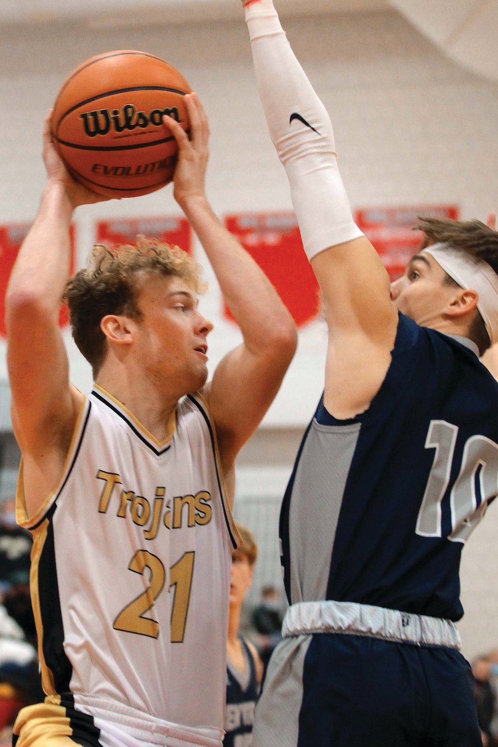 Logan Pinkerton of Covington looks to pass against the defense of Brenner Oliver of Lafayette Central Catholic...Lafayette Central Catholic defeated Covington by the score of 67-49.