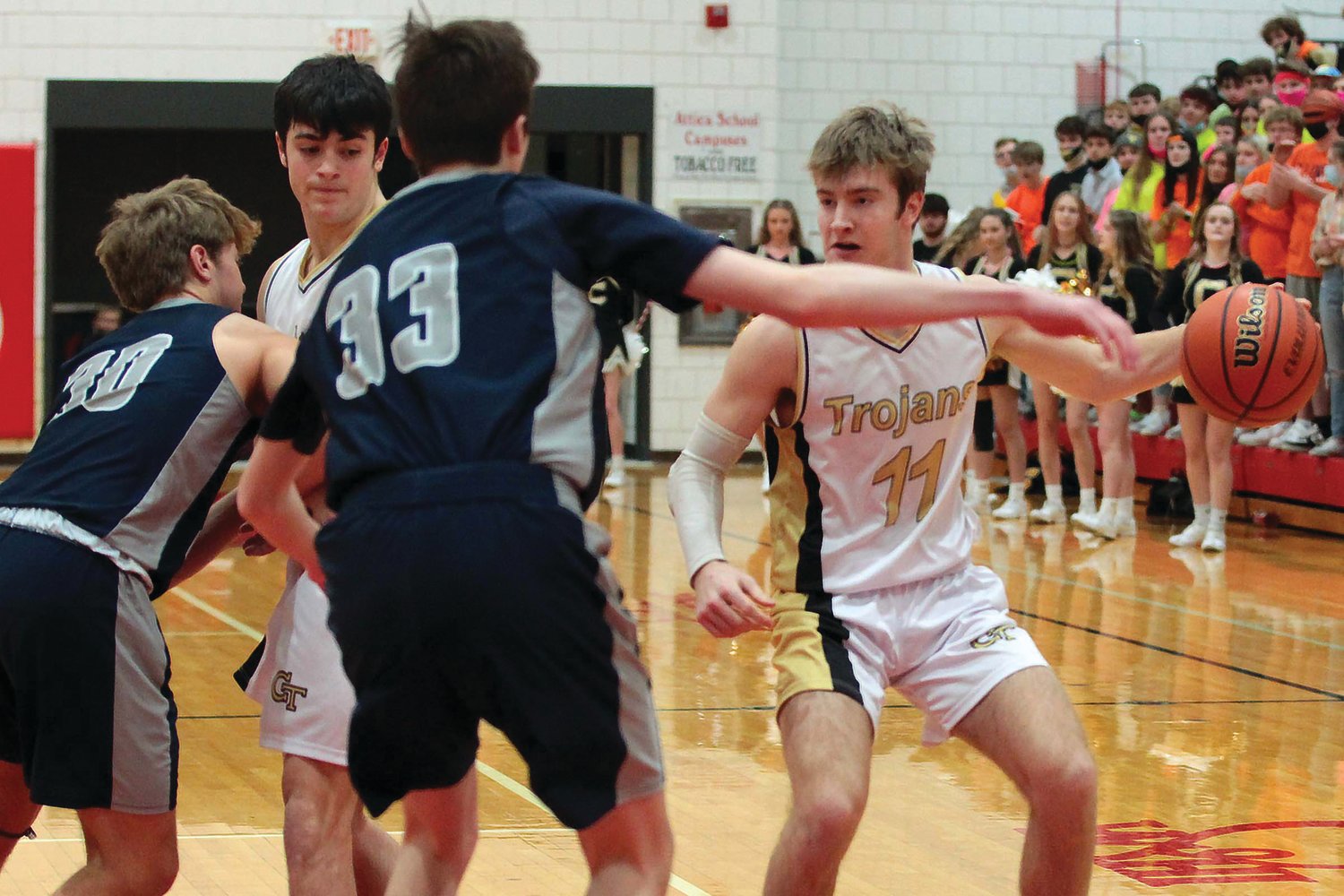 Alan Karrfalt of Covington uses a screen set by Duncan Keller to get past Brenner Oliver of Lafayette Central Catholic...Lafayette Central Catholic defeated Covington by the score of 67-49.