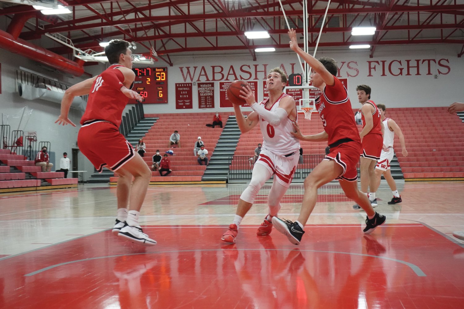 Connor Rotterman drives to the bucket on Wednesday night at Chadwick Court. Wabash sent the senior out with a 91-79 win over Denison.