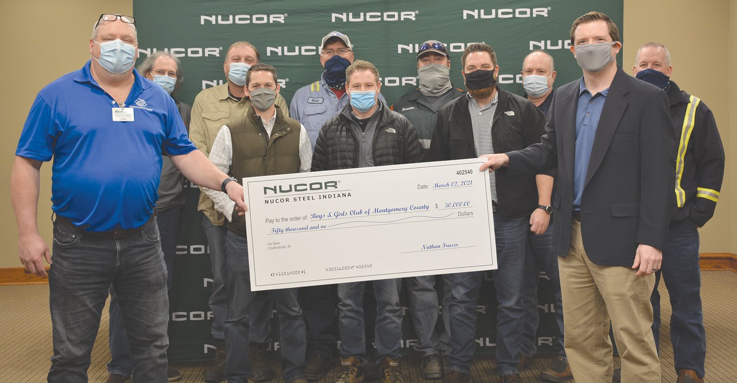 Nucor Steel made a $50,000 donation to the Montgomery County Boys & Girls Club. Pictured, from left, in the front row, are Craig Reeves, Boys & Girls Club executive director, and Nathan Fraser, general manager; middle row, Drew Linder, Scott Shortridge and Eric Radtke; and back row, Doug Brooks, Trevor Beers, Keith Shelton, Brandon Gurley, Ron Kessel and Phil Littell.