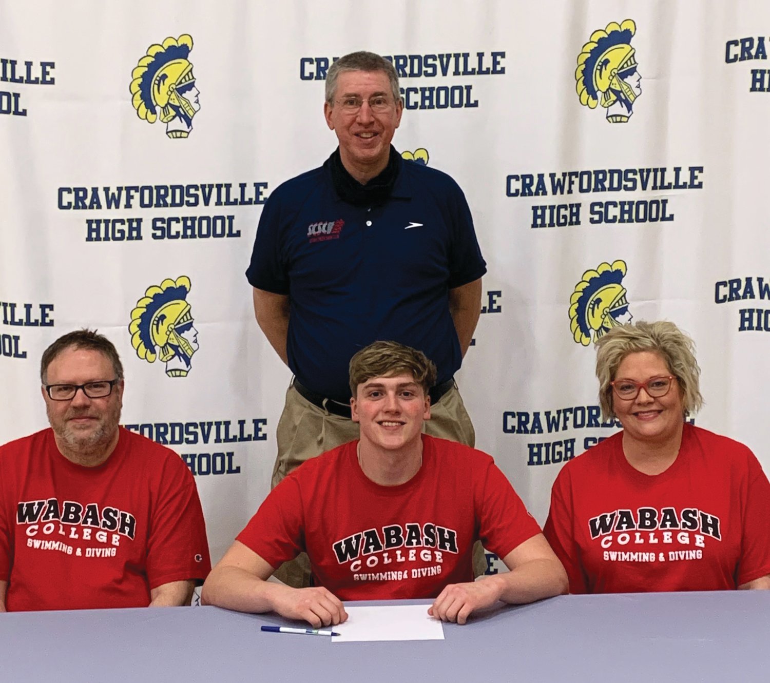 Crawfordsville senior Jack Pendleton will continue his swimming career at Wabash College. PICTURED: Jack Pendleton and parents Mike and JeneAnne Pendleton with Crawfordsville swim coach Kevin Hedrick.