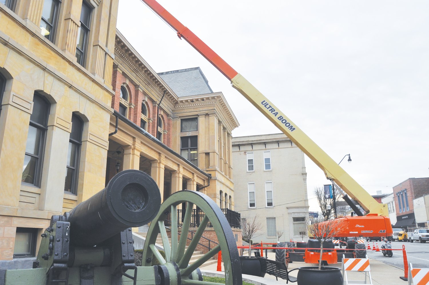 A crane reaches to the top of the Montgomery County Courthouse Tuesday. Crews from South Bend-based Midland Engineering were hired to perform gutter repairs on the courthouse. The sidewalk was closed on the south side of the building during the repairs.