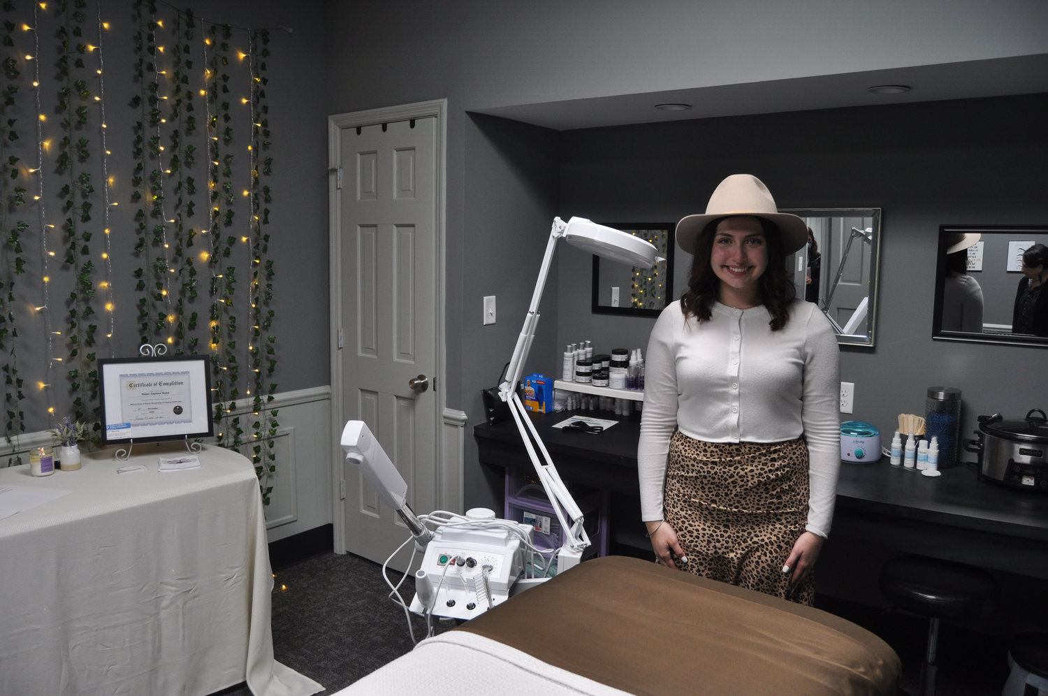 Demi Haas stands in her business djh esthetics and brows in the Weemickle Building in downtown Crawfordsville. Haas shares the space with Lilly Wallace’s women’s fashion store, Maive’s Boutique.