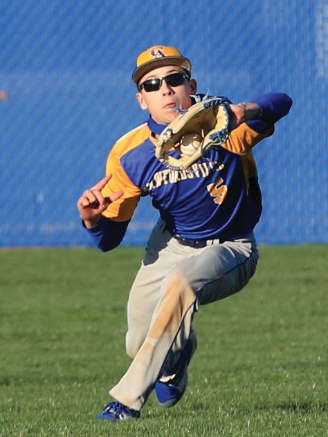 Crawfordsville junior Evan Chaney makes a diving grab in centerfield for the Athenians.