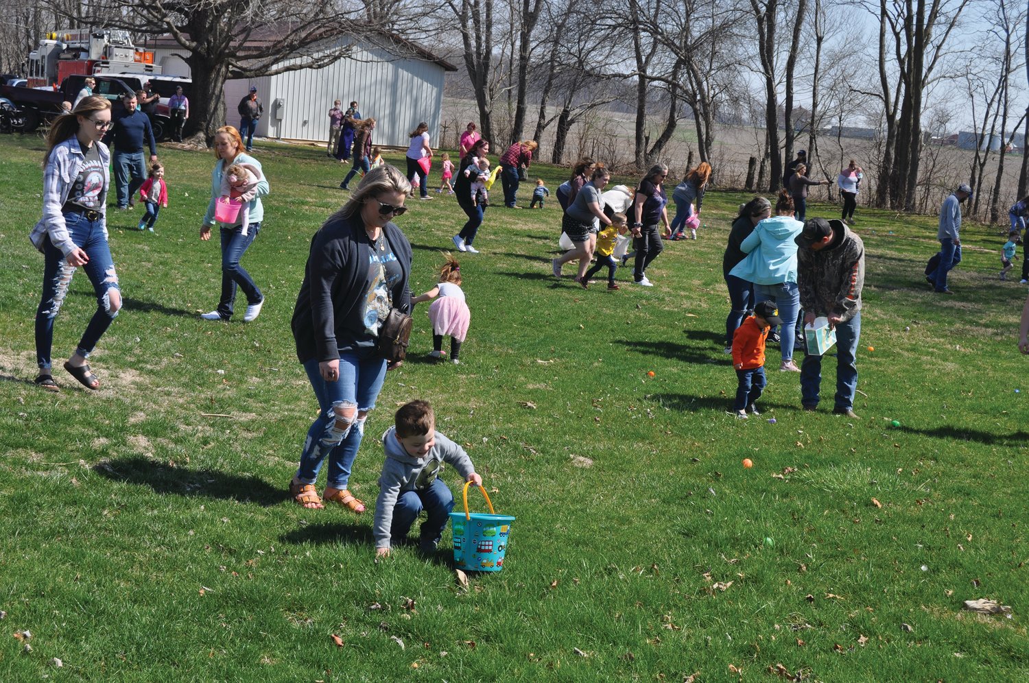 Families hunt Easter eggs at Tremaine Park in Waynetown Saturday. The egg hunt was sponsored by the Waynetown Merchants Association.