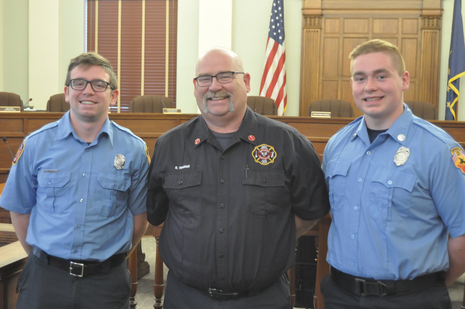 Gavin Waddell, right, stands with his father Buck and brother Wyatt in the City Building on Wednesday. Gavin Waddell was just sworn in as a Crawfordsville firefighter/EMT.