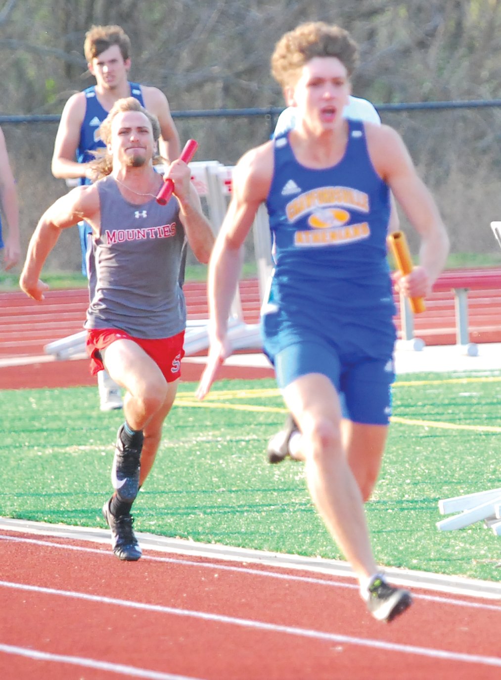 Southmont's Dillan Lauy tries to chase down Crawfordsville's Ty Lynas in the 4X100 meter relay.