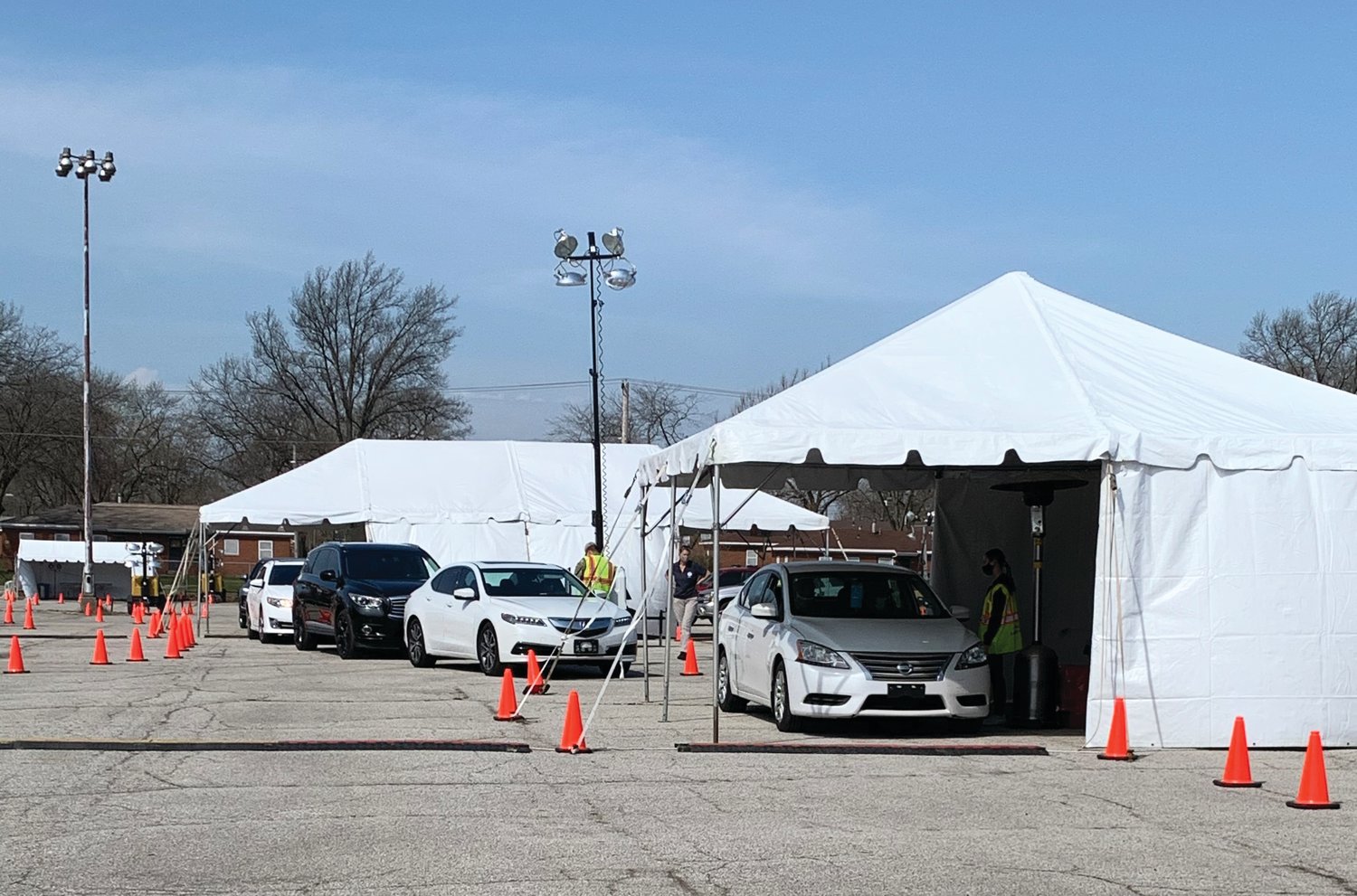 Cars line up at a mass COVID-19 vaccination site in Gary. Montgomery County Emergency Management Agency Director Shari Harrington deployed with a statewide task force to help run the site.