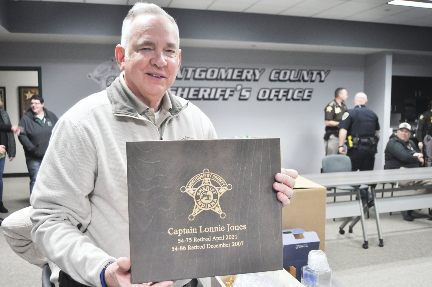 Capt. Lonnie Jones of the Montgomery County Sheriff’s Office holds a plaque commemorating his retirement Wednesday at the Montgomery County Jail. Jones first joined the department in 1988 and had served as jail commander since 2011.