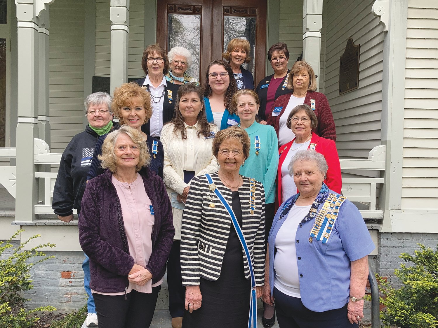 Members of the Dorothy Q Chapter Daughters of American Revolution stand on the steps of Elston Memorial Home with state regent Charlotte Blair on Saturday. The organization dedicated a plaque honoring Revolutionary War veterans at the local chapter house.
