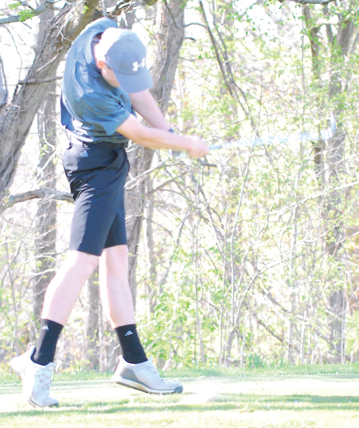 Luke Tesmer tees off on the par-3 No. 17 at the Crawfordsville Country Club on Monday evening.