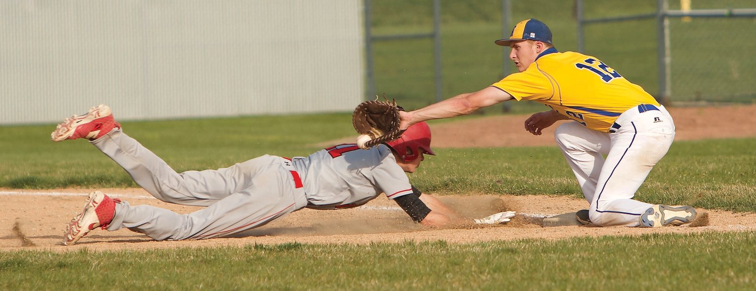 Southmont's Chayce Howell dives back safely into first-base.